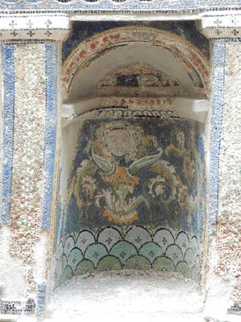 III.3 Herculaneum, May 2018. Detail of niche of mosaic and shell-trimmed aedicula.
Photo courtesy of Buzz Ferebee.